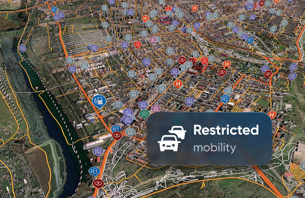 Aerial map highlighting city roads with icons for facilities and services. A "Restricted mobility" sign overlays the map in the lower right corner.