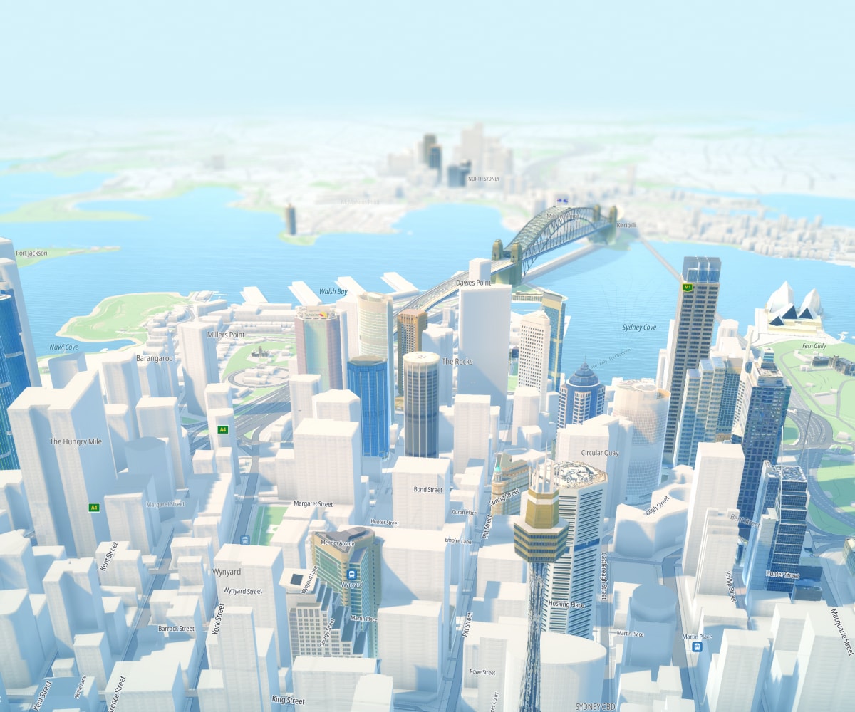 Aerial view of a stylized cityscape with skyscrapers, a prominent bridge, and a body of water in the background under a clear sky.