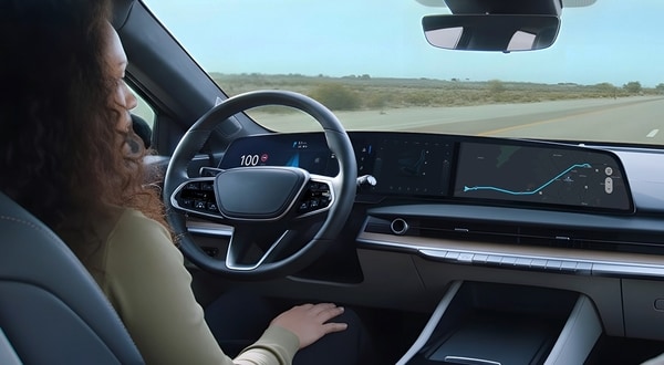 A driver using next-gen automotive technology