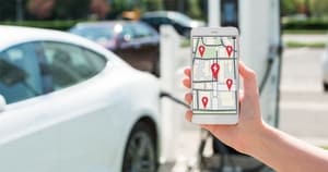 A picture showing an EV charging with an acompanying phone app