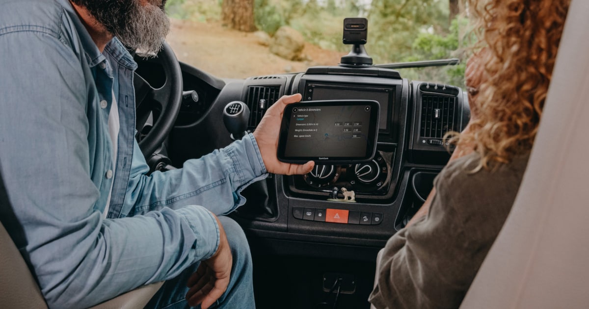 campre gps sat nav device being hold in hand