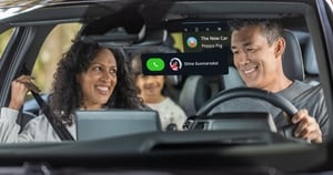 A family enjoying a drive taking advantage of in-car AI infotainment.