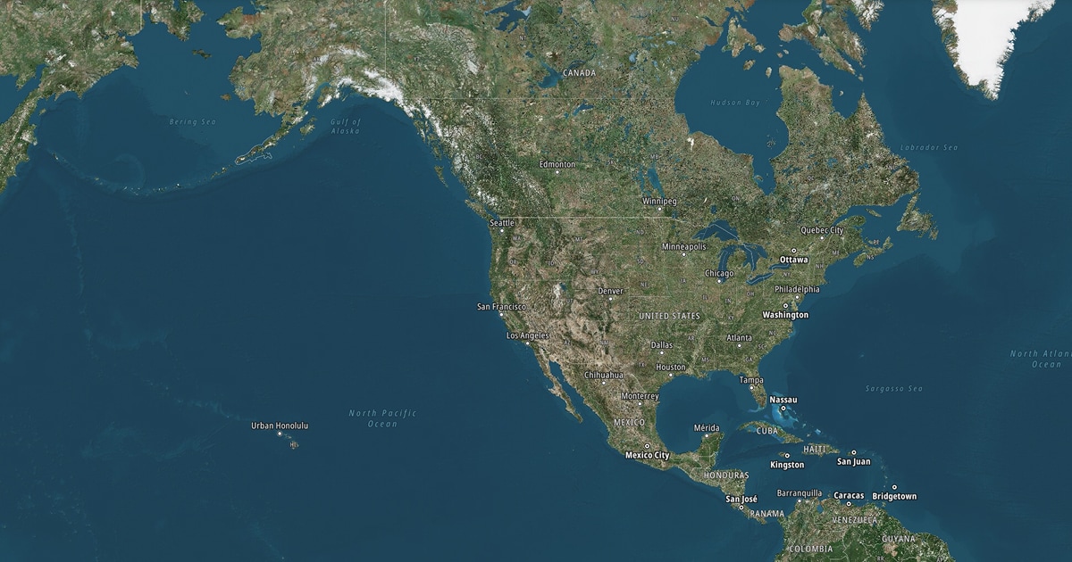 Satellite map of North America, showing countries, cities, and bodies of water, including the Pacific and Atlantic Oceans.