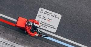 Birds eye view shot of delivery cyclist including stats about delivery delay, address and instructions