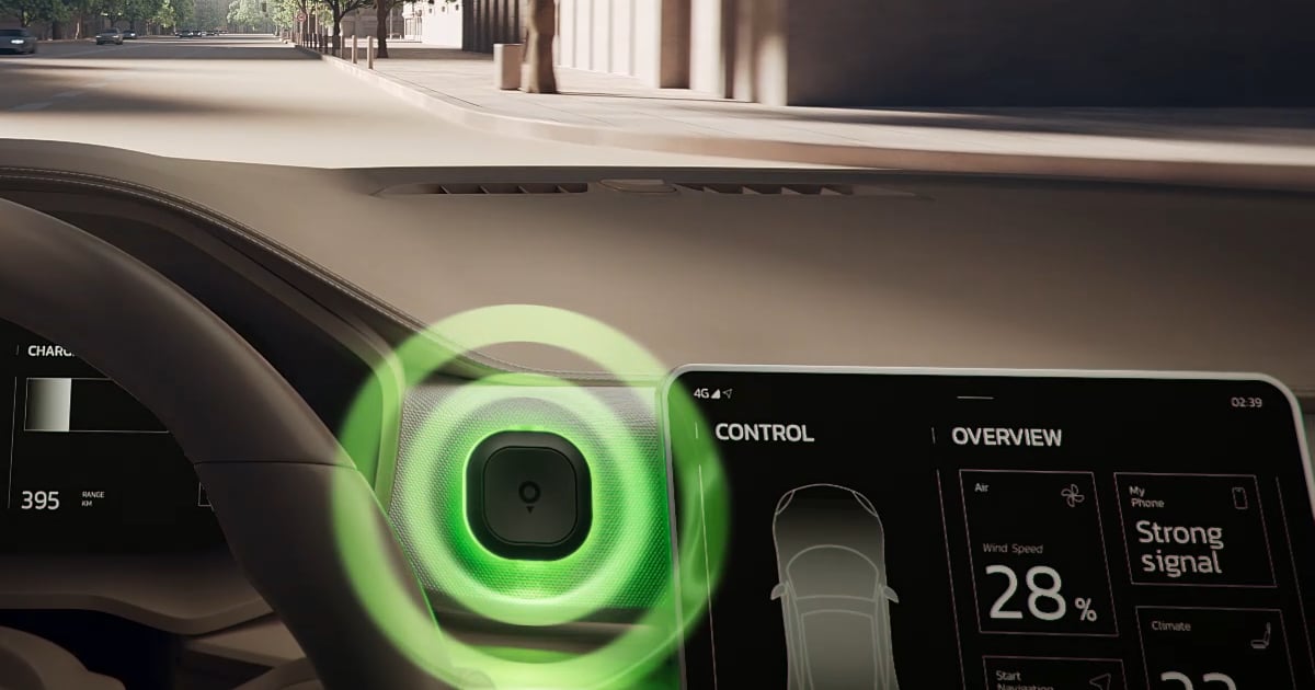 A car dashboard displaying a digital screen with speed and signal information, alongside a glowing green tom by tomtom device