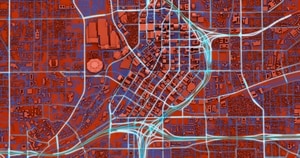 Abstract city map with red and blue color scheme, highlighting streets and buildings in a grid-like pattern.