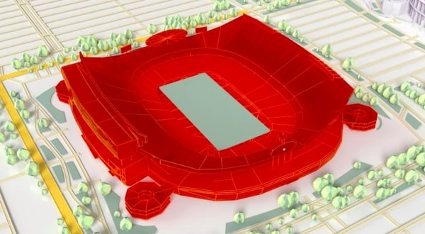 3D model of a large stadium highlighted in red, surrounded by trees and roads on a map.