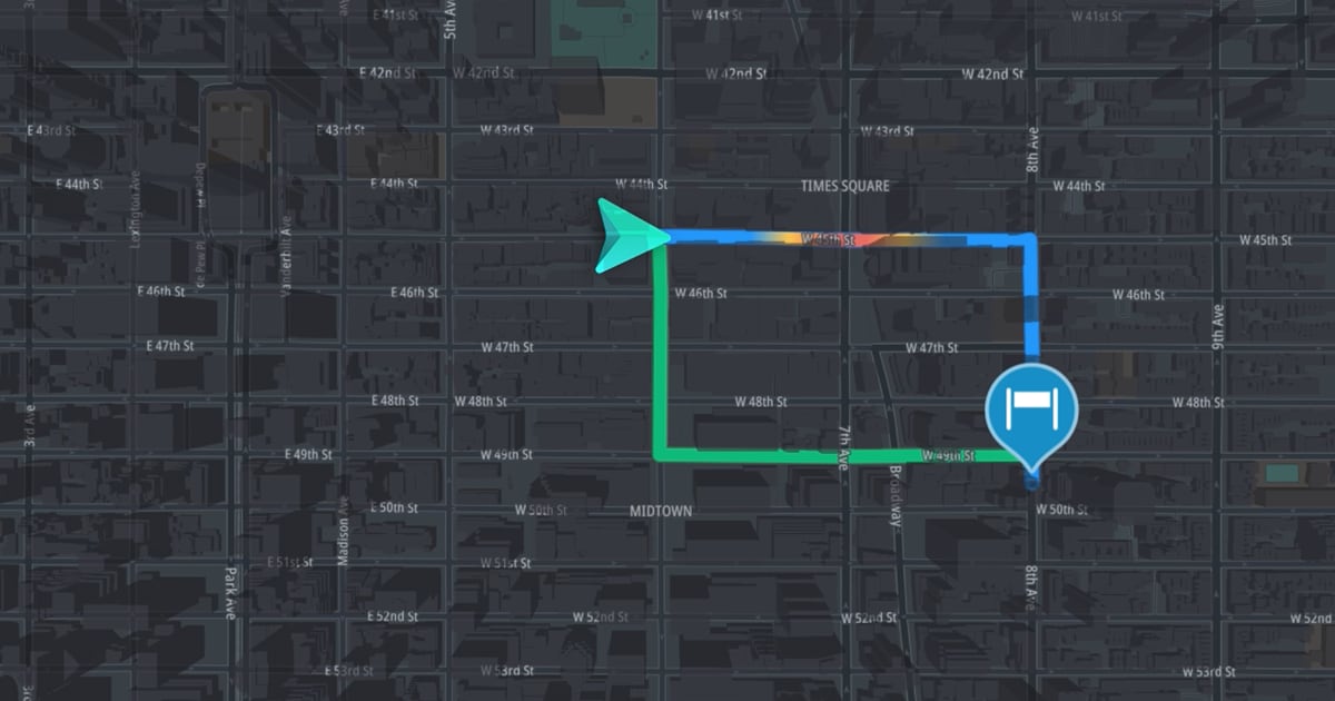 Digital map showing a route around Times Square, Midtown, with a blue path and a location marker labeled "H" on 8th Ave.