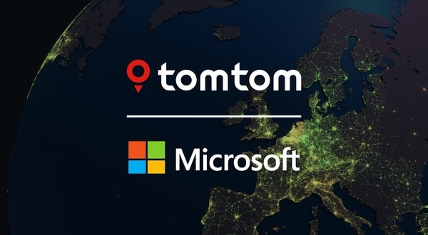 TomTom and Microsoft logos on a satellite view of Europe at night, with glowing city lights visible across the continent.