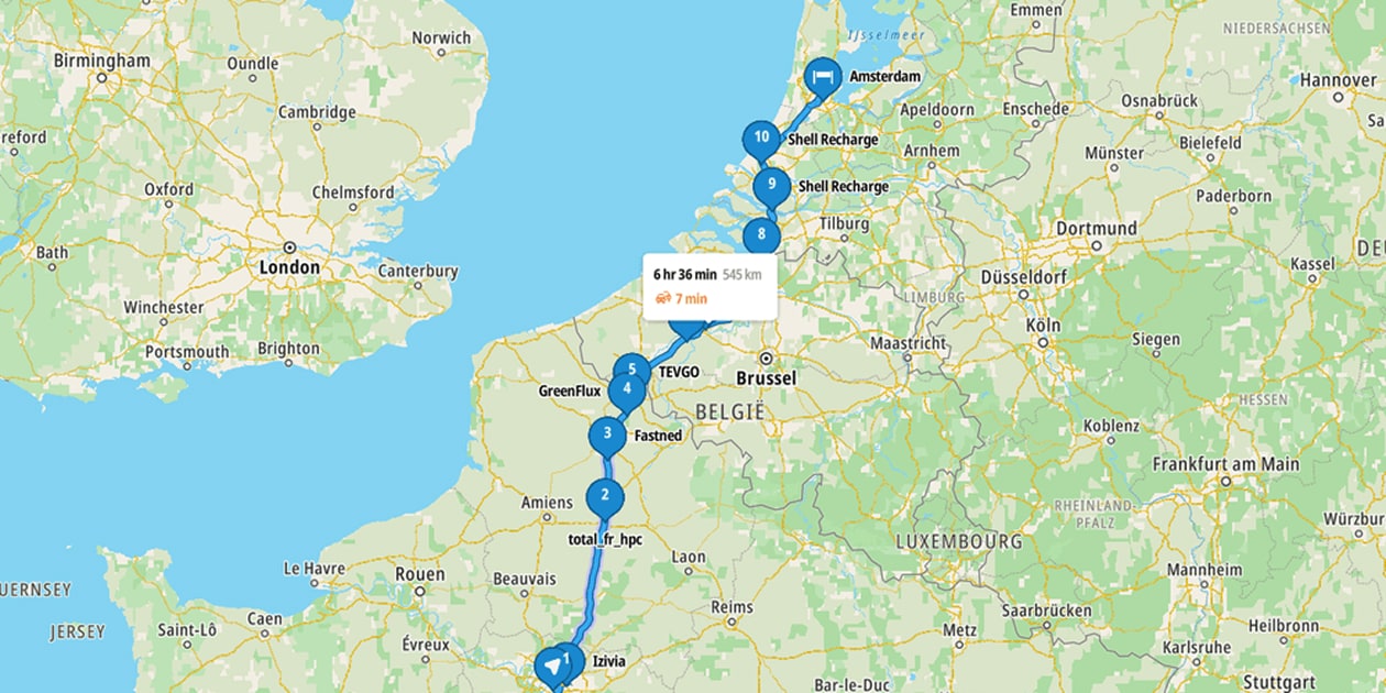 Map showing a route from northern France to Amsterdam with multiple charging stations marked, estimated travel time of 6 hours 36 minutes.