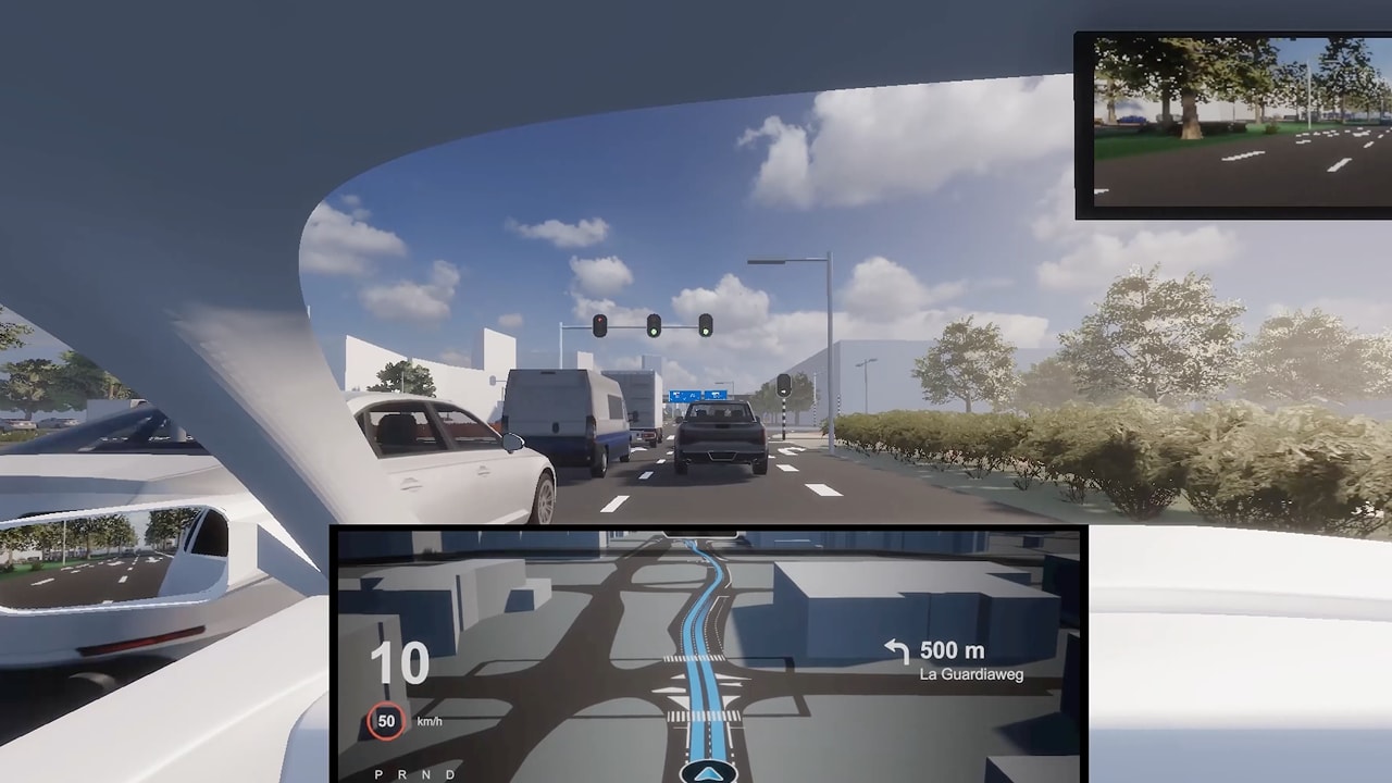 A car interior view showing a busy urban road with traffic, a digital navigation display, and a police car up ahead under a clear blue sky.