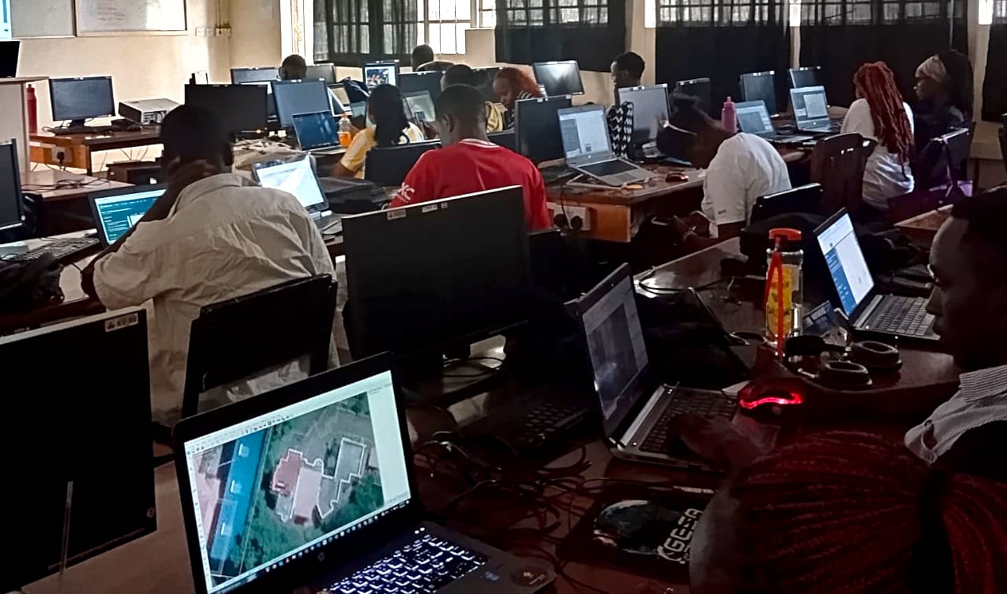 Community mappers in Kenya working on building footprints