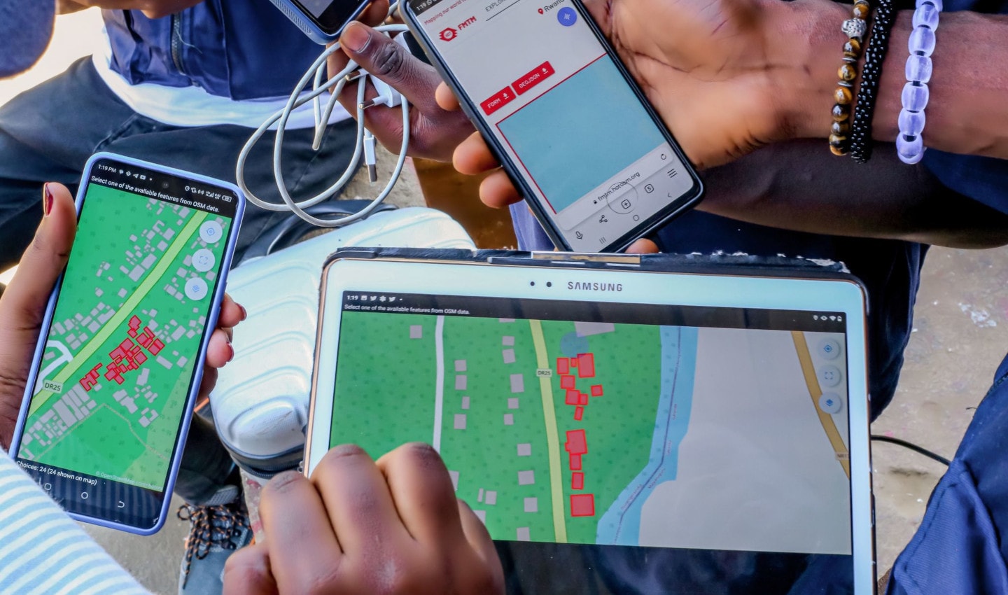 Community mappers using phones and tablets to map buildings in Rwanda