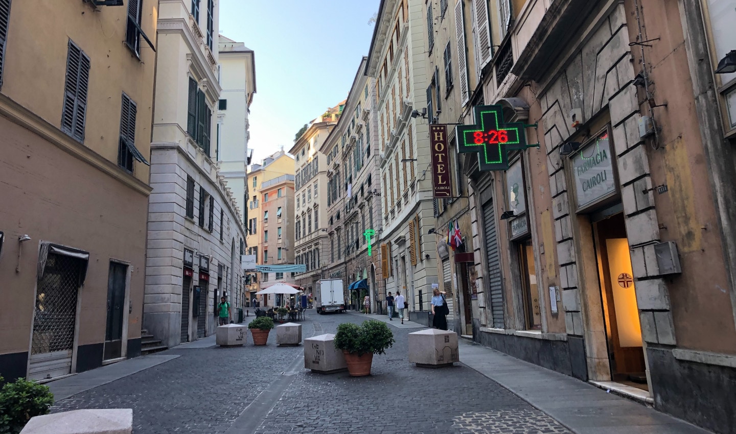 A city street featuring concrete calverts to stop traffic