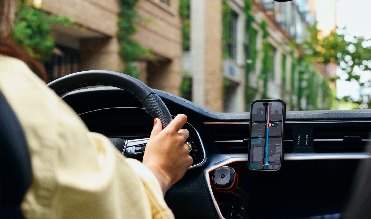 A driver using the TomTom app to navigate