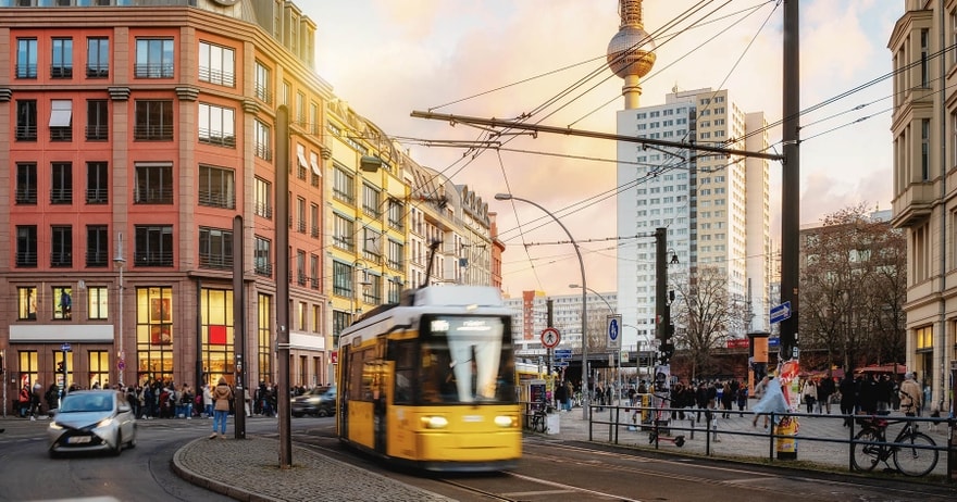 A street with multiple modes of transport — cars, trams, bicycles etc.