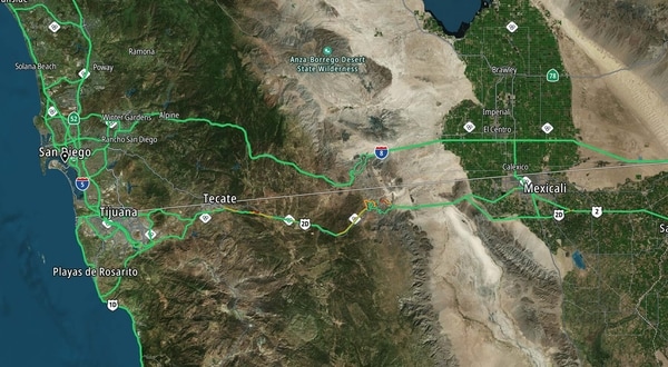 Satellite map showing San Diego, Tijuana, Tecate, and Mexicali with road networks and natural terrain, including the Anza-Borrego Desert.