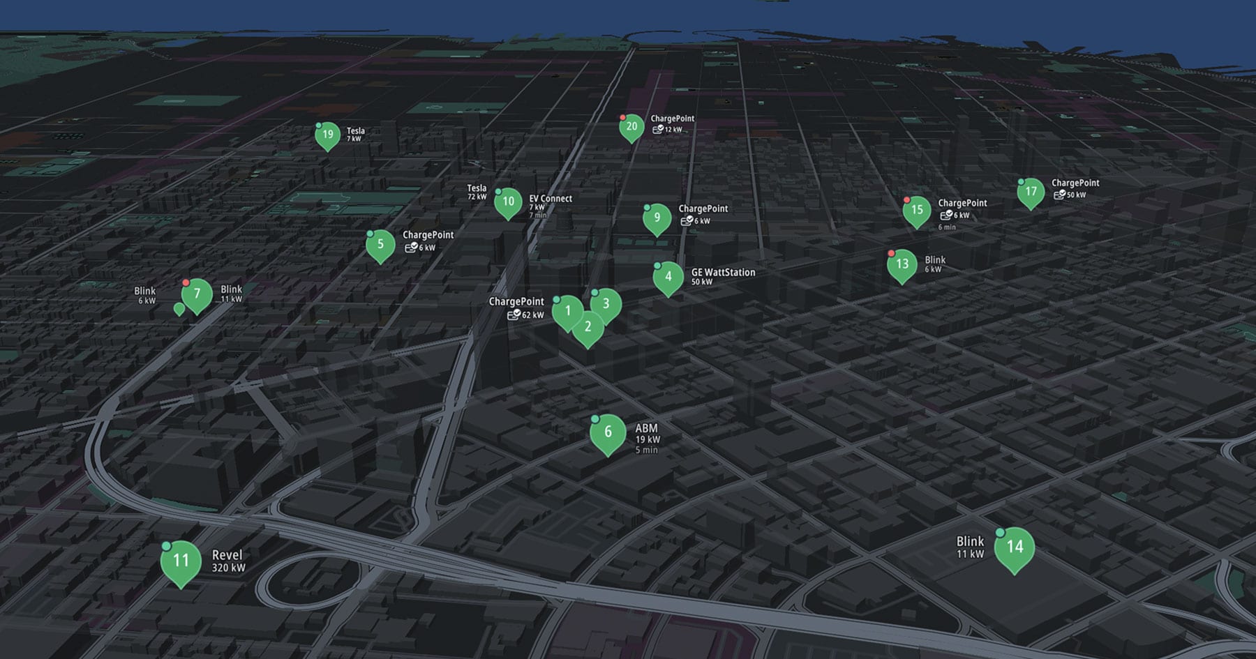 A 3D city map displaying multiple electric vehicle charging stations, marked with icons and labels indicating different power levels and brands.