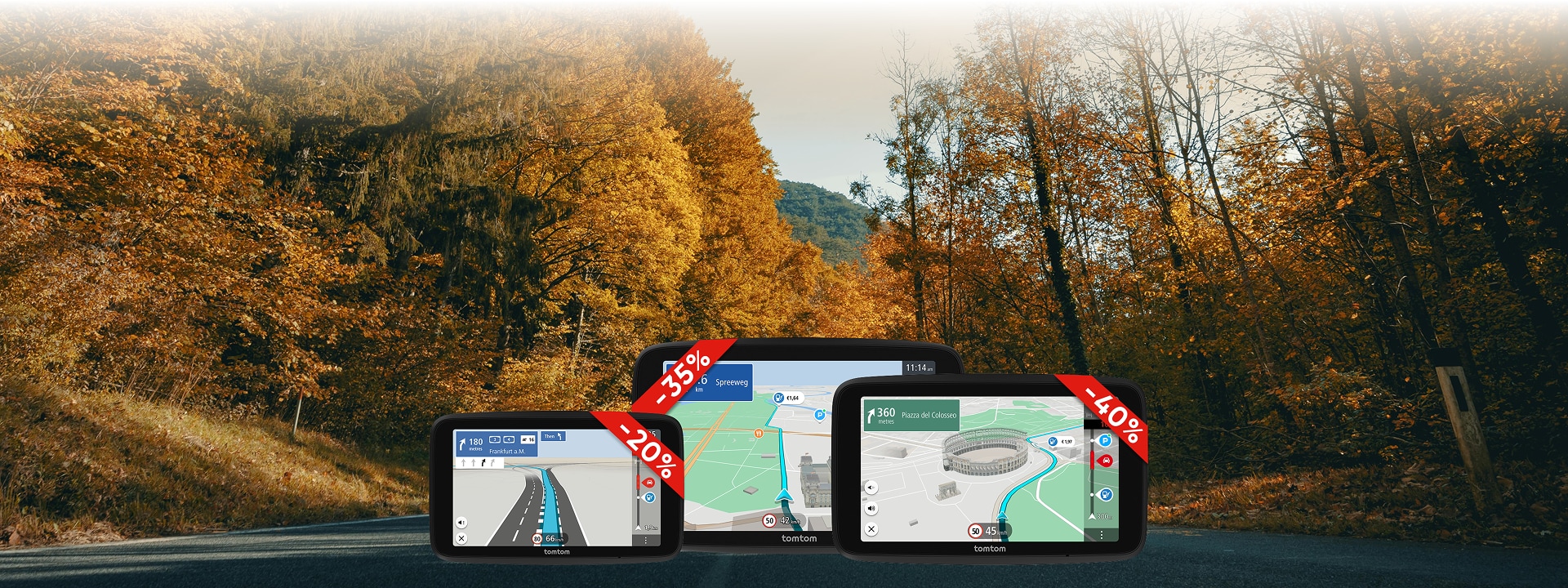 Three GPS devices with discount tags display maps, set against a scenic autumn forest road.