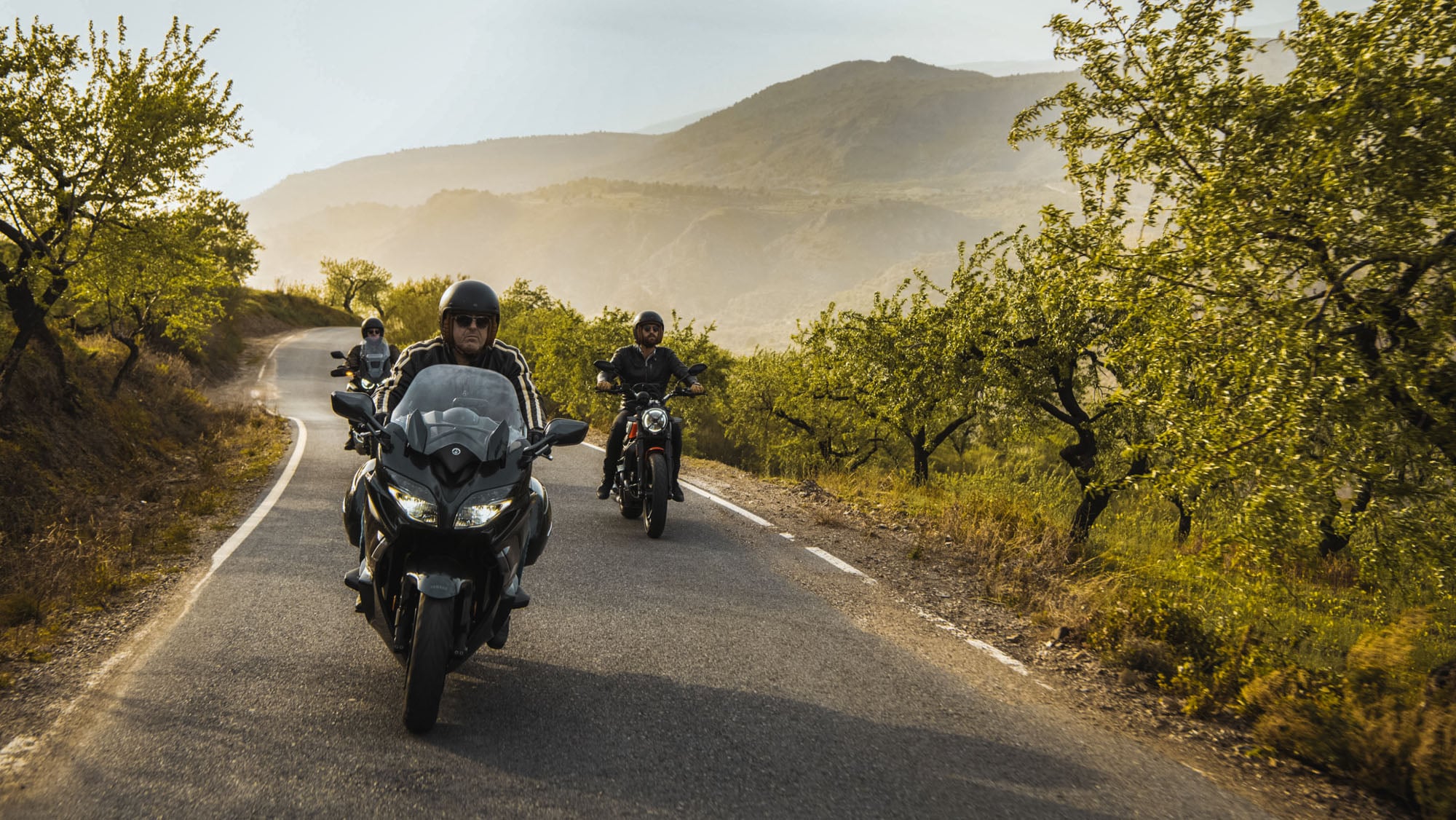 Group of riders with their motorcycles running happily using Motorcycle Sat Nat