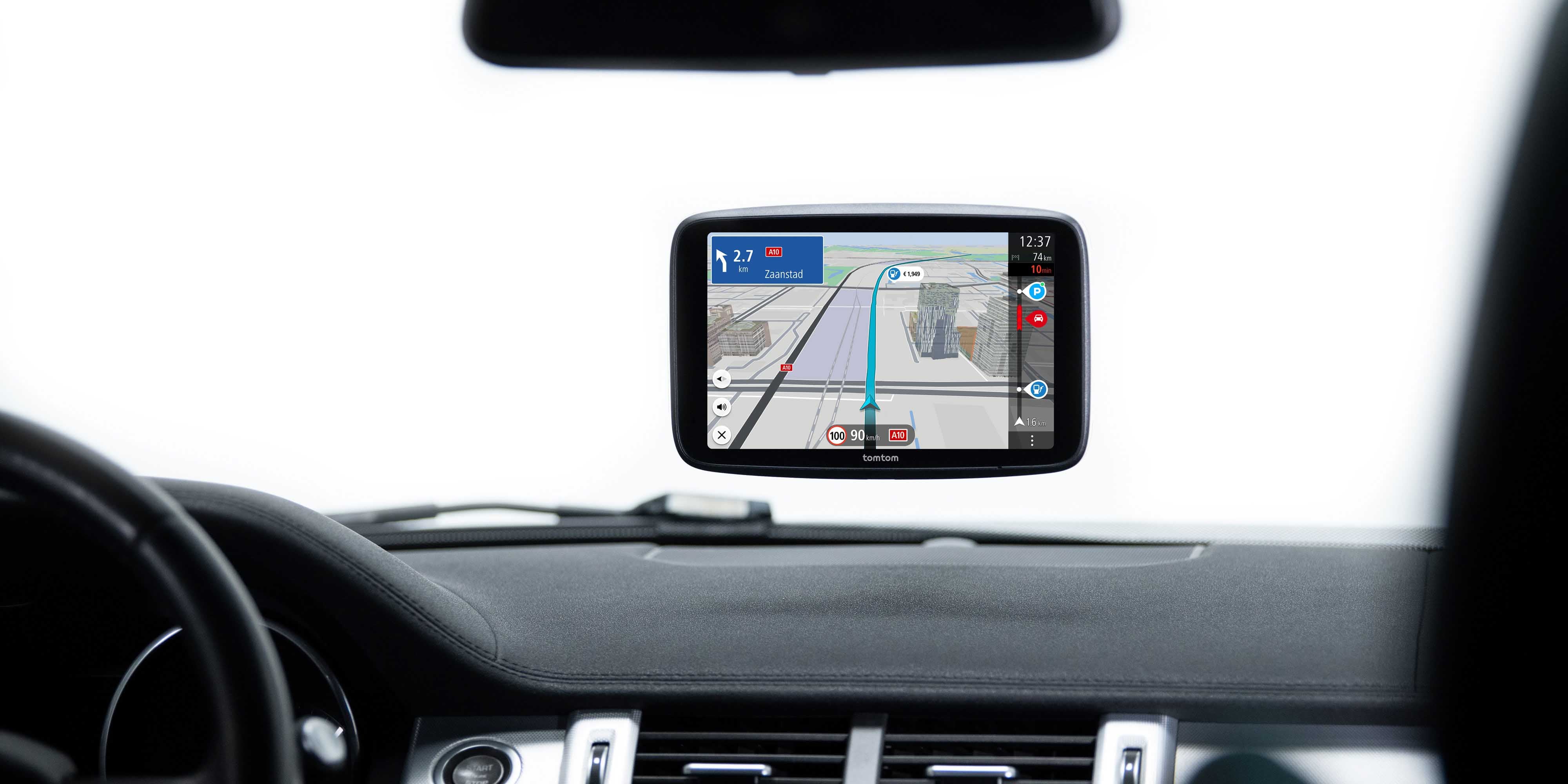 TomTom car sat nav device being used to guide driver